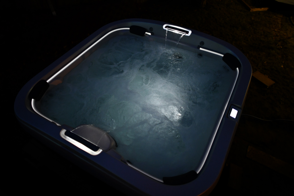 Illuminated Jacuzzi Hot Tub at night.